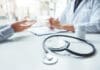 Doctors and patients consulting and diagnostic examining sit and talk. At the table near the window in the hospital medicine concept