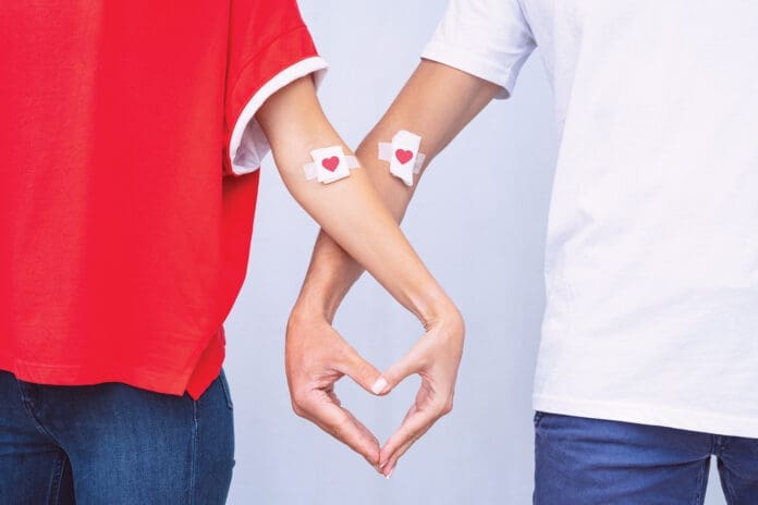 Blood donation. World blood donor day. Man and woman after giving blood. Save lives concept.