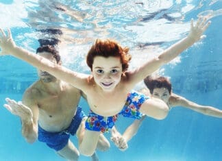 NWFL Regional Aquatic Center Set for Huge Economic Impact Locally Family swimming in pool