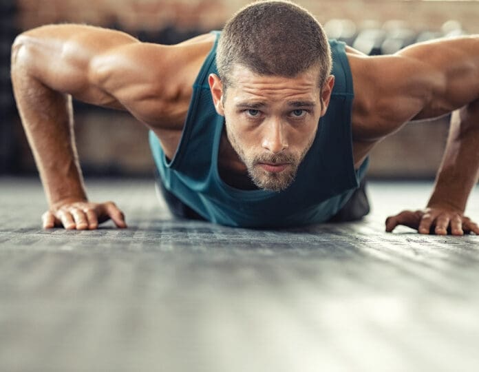Young athlete doing push ups