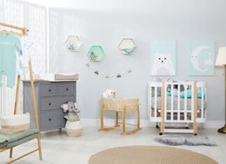 Cozy baby room with crib and other furniture. Interior design