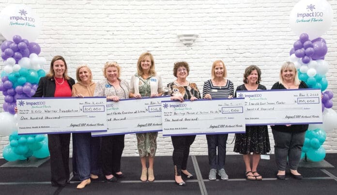 Impact100 of Northwest Florida with check Impact100 of Northwest Florida with check