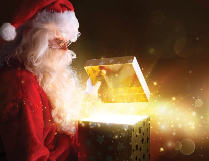 Traditional Santa Claus With Gifts And Sparkle Stars