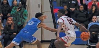 A member of the Eglin Eagles basketball team attempts to steal a ball from a member of the Hurlburt Field Air Commandos, at Hurlburt Field, Florida, Jan. 10, 2025. The game, known as the Emerald Coast Rivalry, brought both base communities together to watch their teams compete. (U.S. Air Force photo by Airman 1st Class Samantha Rossi)