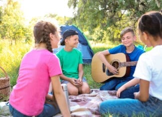 Group of children resting at summer camp