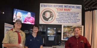 Museum indoor rail gun ribbon cutting