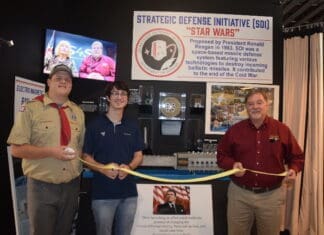 Museum Series: Ribbon cutting at Heritage Museum of Northwest Florida Museum indoor rail gun ribbon cutting