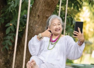 How to Make Enrollment in Medicare Smooth and Easy Older lady swining iStock 2168569975