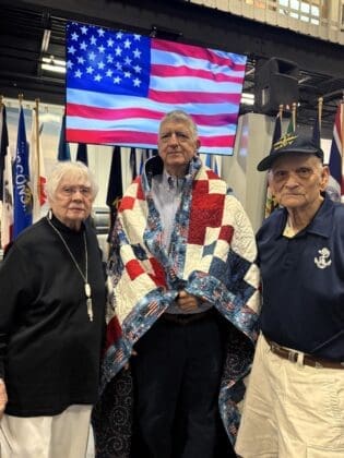4 Rotarian Jess Parnell with Fellow Quilt of Valor honoree Rotarian Bert Melnick and Bert Rotary Partner Mary Jo
