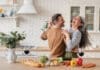 Happy Couple in Kitchen iStock 1328351784