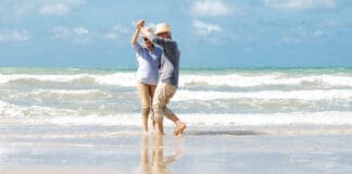 Seniors dancing on beach iStock 1322107306 696x409