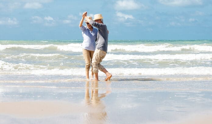 Seniors dancing on beach iStock 1322107306 696x409