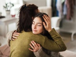 Teenager Hugging Parent iStock 1476266423
